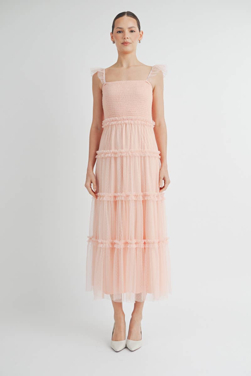Front view of Clovette Midi Dress in blush pink with smocked bodice and ruffle tiers