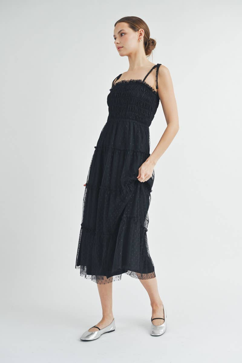 Full-length image of Clovette Midi Dress in black highlighting elegant evening look