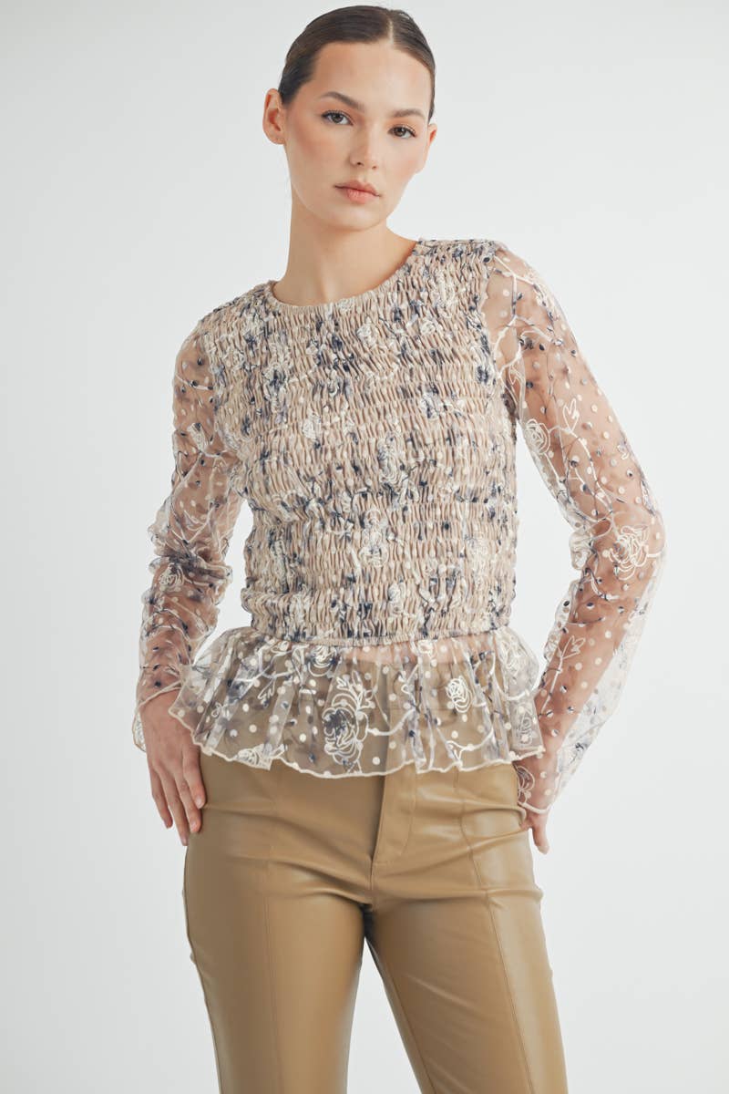 Elowen Peplum Top Model wearing cream embroidered peplum top styled with jeans for a casual chic look