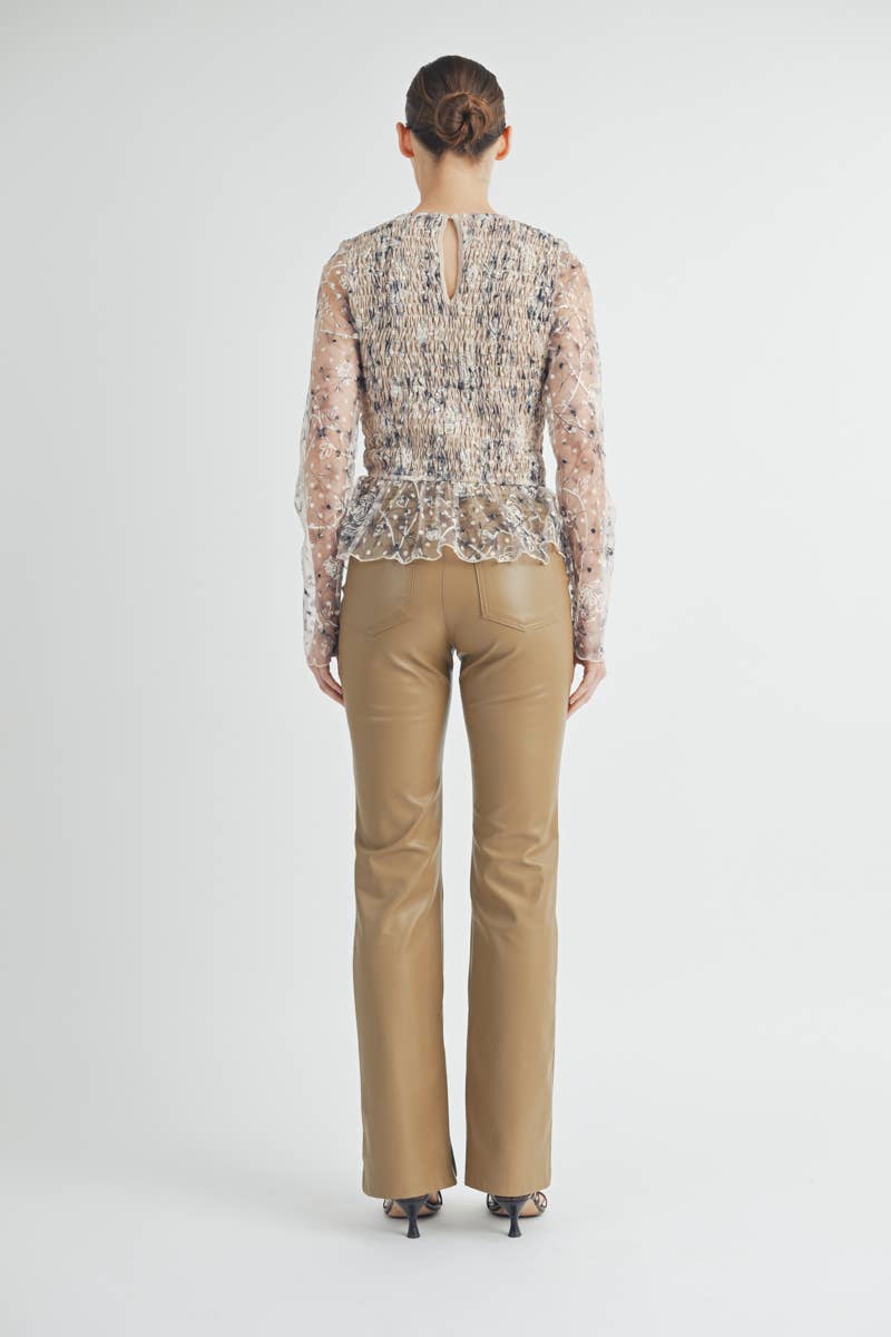 Back view of Elowen Peplum Top with keyhole button closure