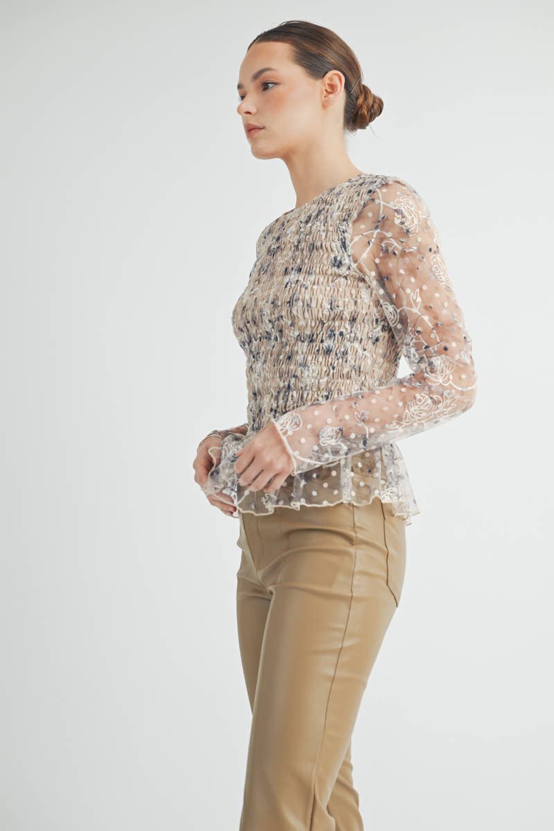 Full-length image of Elowen Peplum Top highlighting feminine design