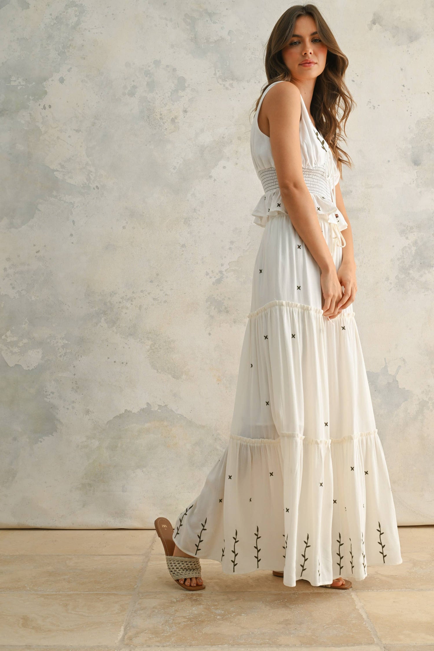 Front view of the embroidered tiered skirt showing the flowing silhouette and feminine drape.