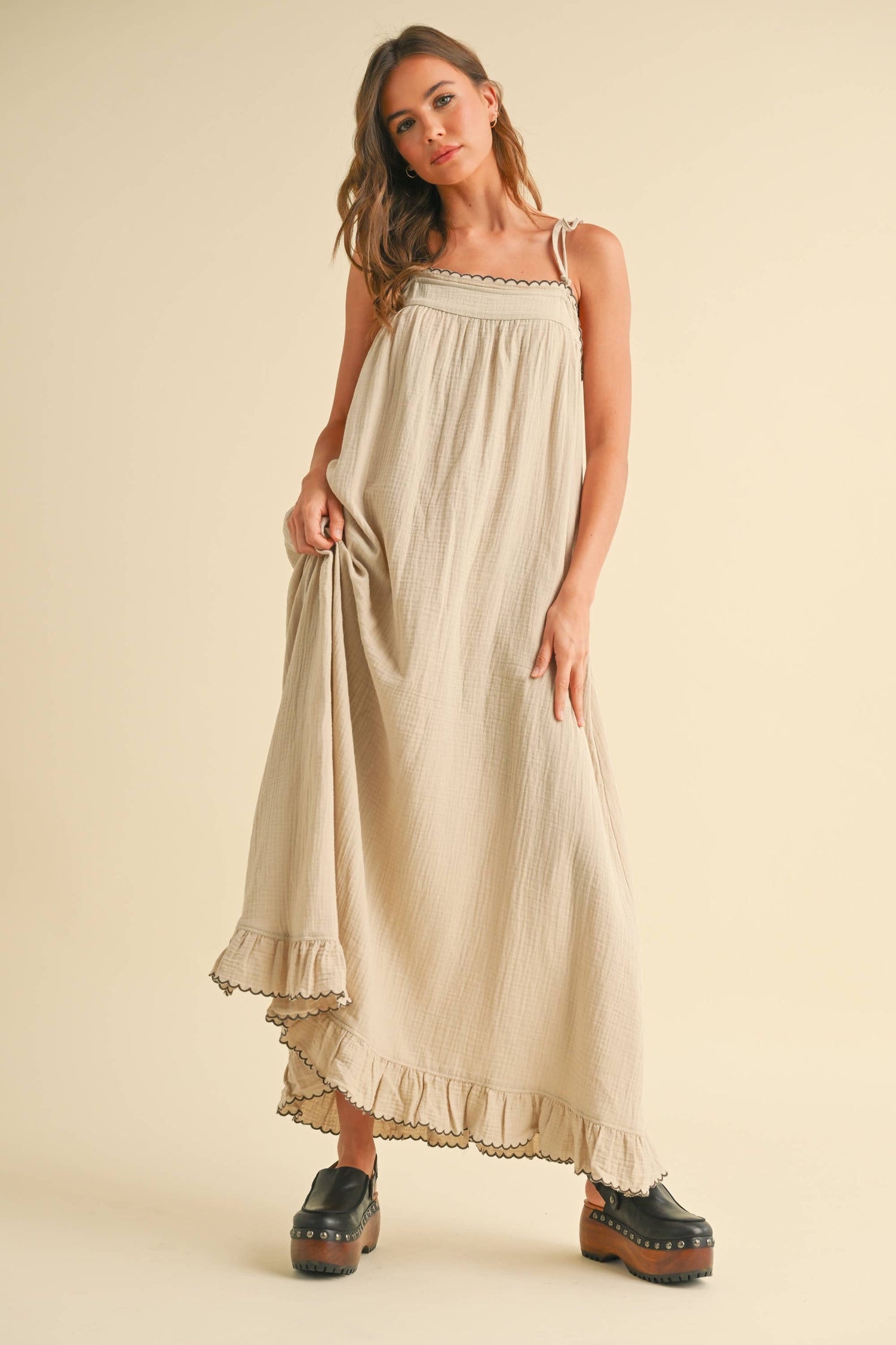 Front view of the tan embroidered maxi dress showing the relaxed silhouette and soft gauze drape.