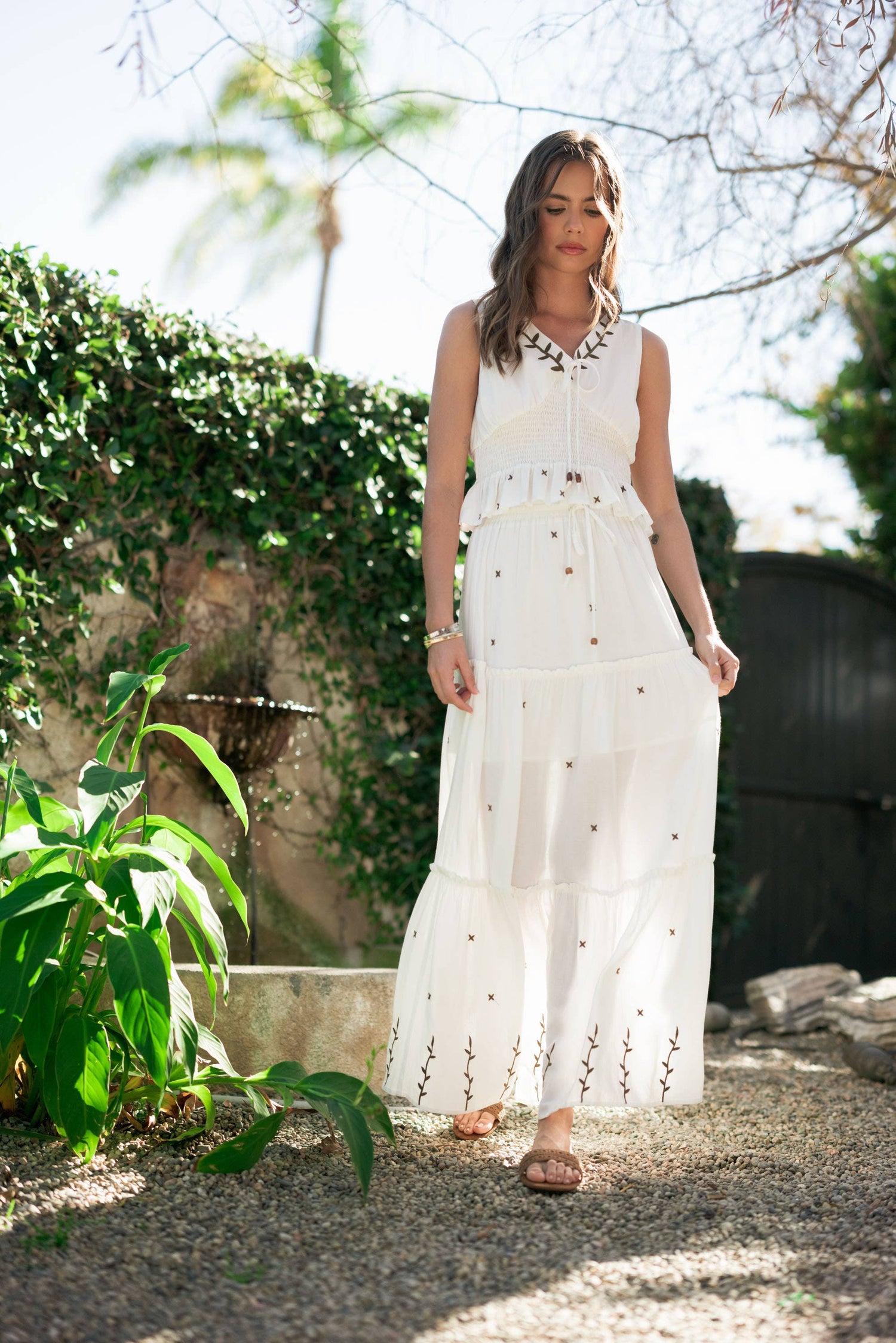 Front view styled with the matching smocked top, highlighting the coordinated embroidered set.