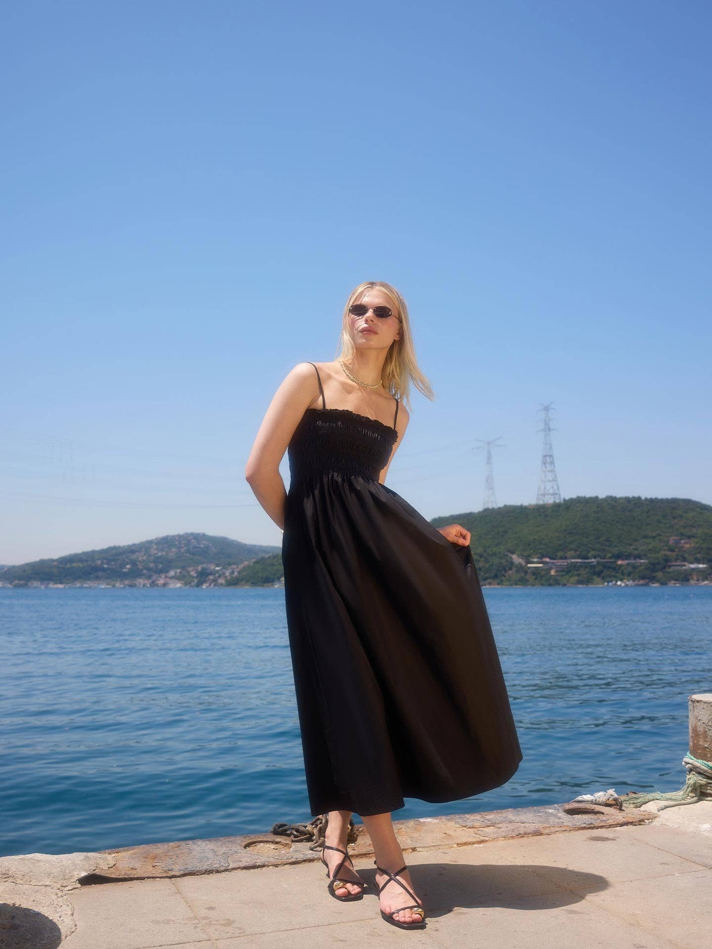 The Black Guipé Strap Maxi Dress showcasing A-line style