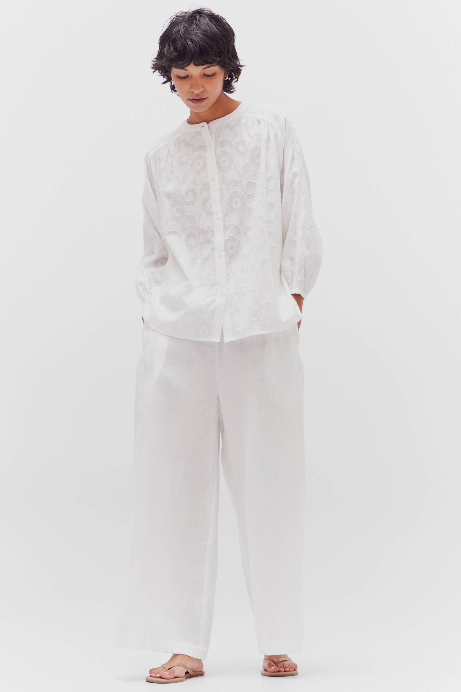 Jacquard patterned white blouse in 100% cotton with high neckline.