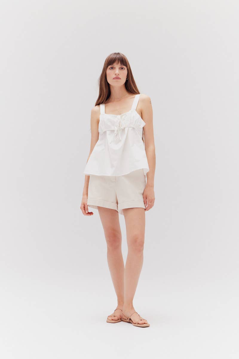 The Milk Twill Shorts are classic tailored shorts in white colourway