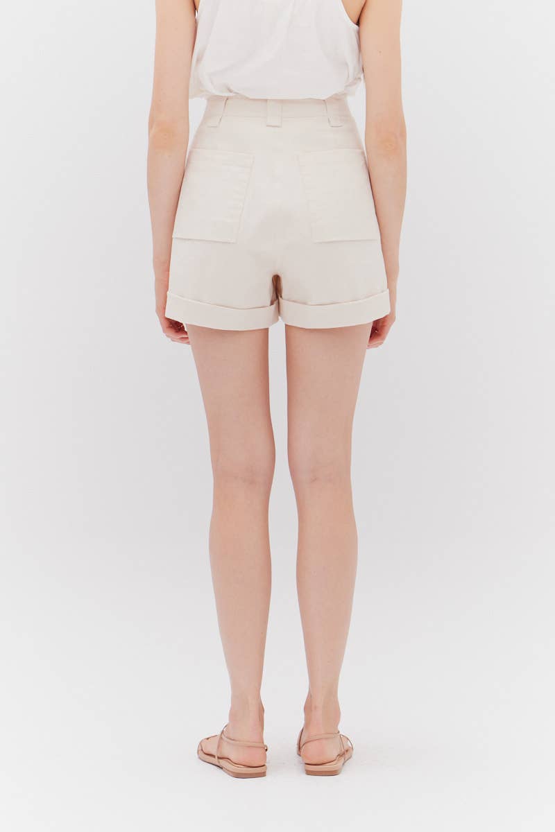 The Milk Twill Shorts - rear view showcasing belt loops, pockets and cuffs.