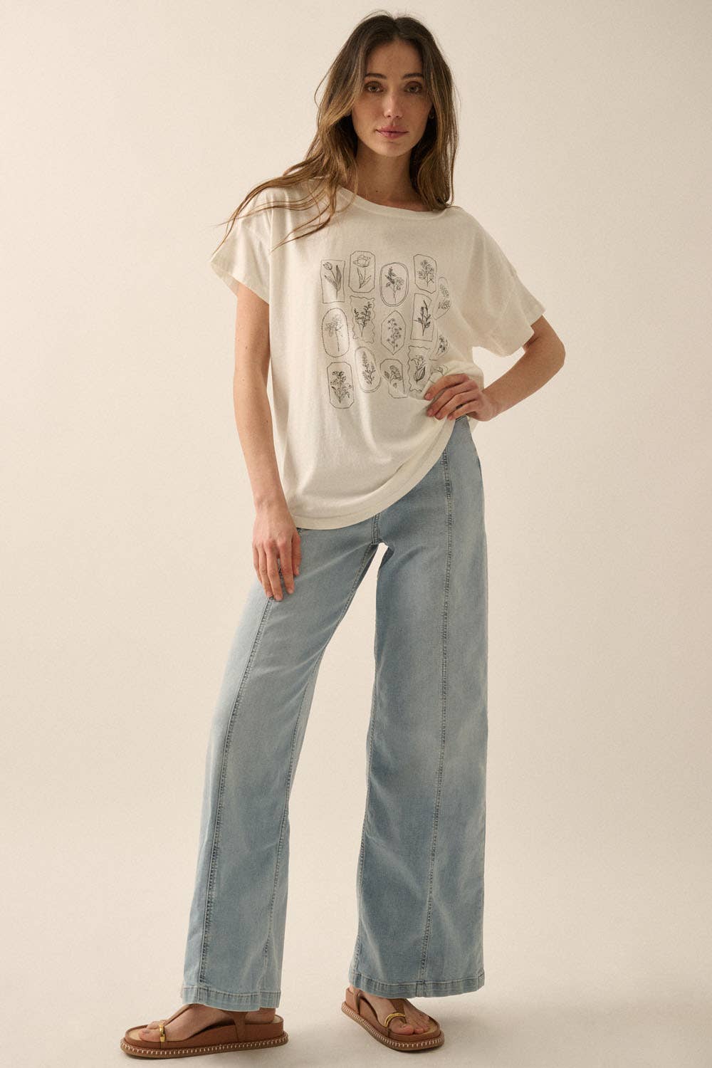 Amarae Graphic Tee styled with blue jeans, showcasing relaxed fit, curved hem and effortless everyday styling