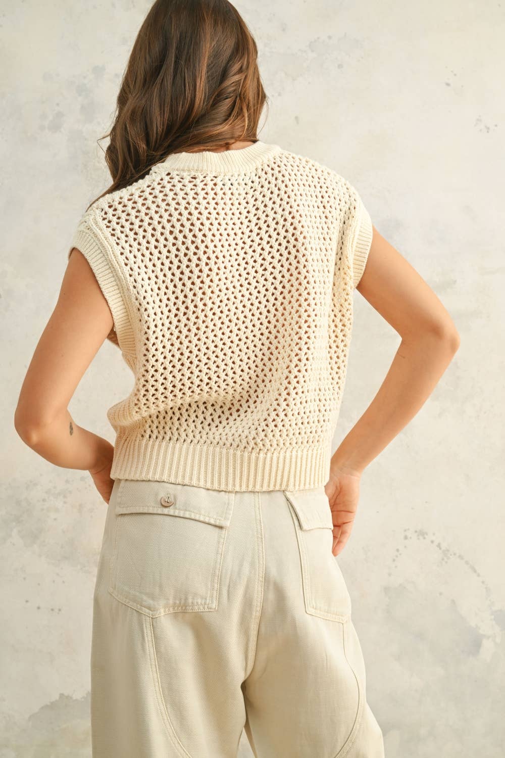 Back view highlighting the lightweight knit and elegant, casual silhouette.