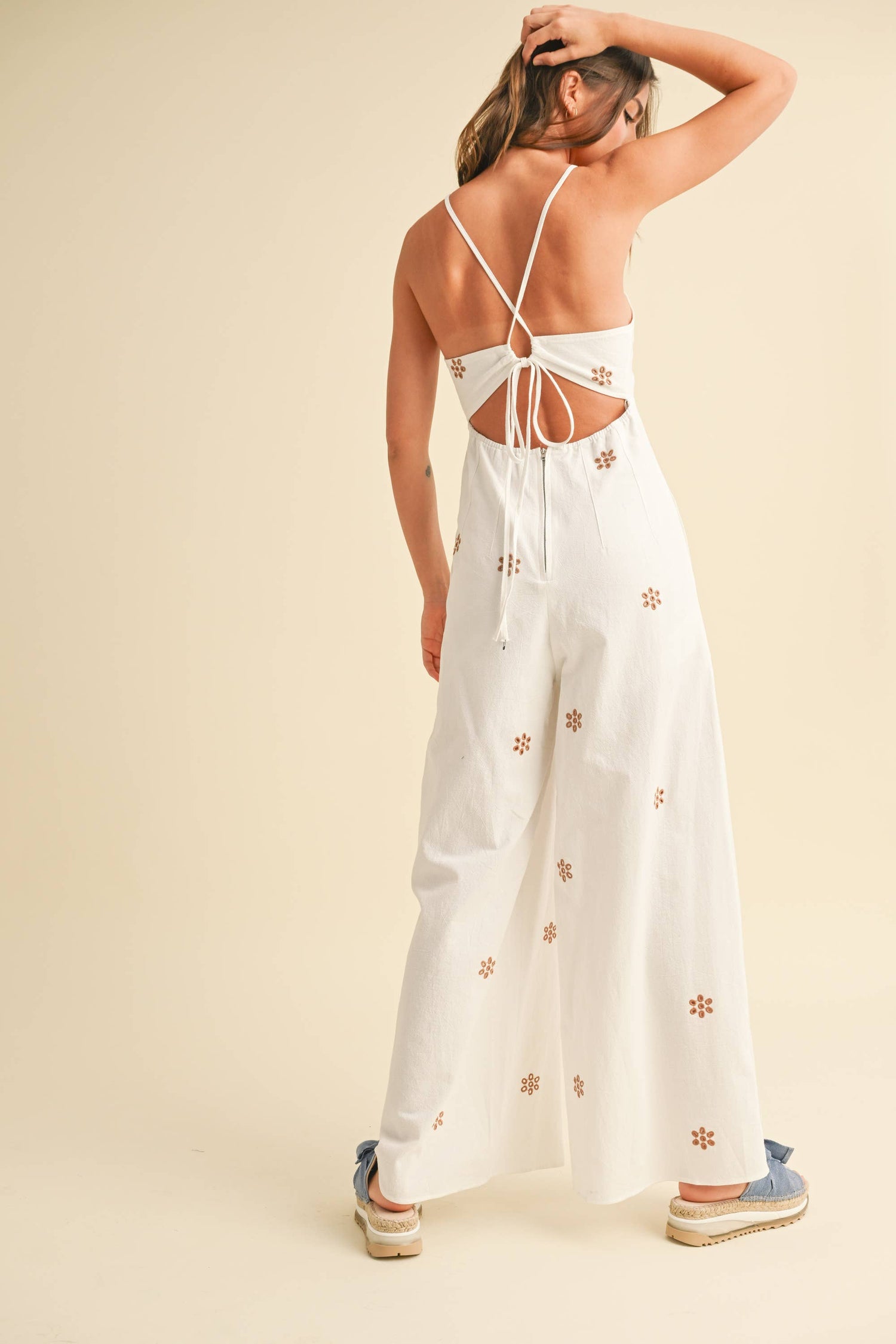 Back view showcasing the embroidered detailing and flattering streamlined shape.