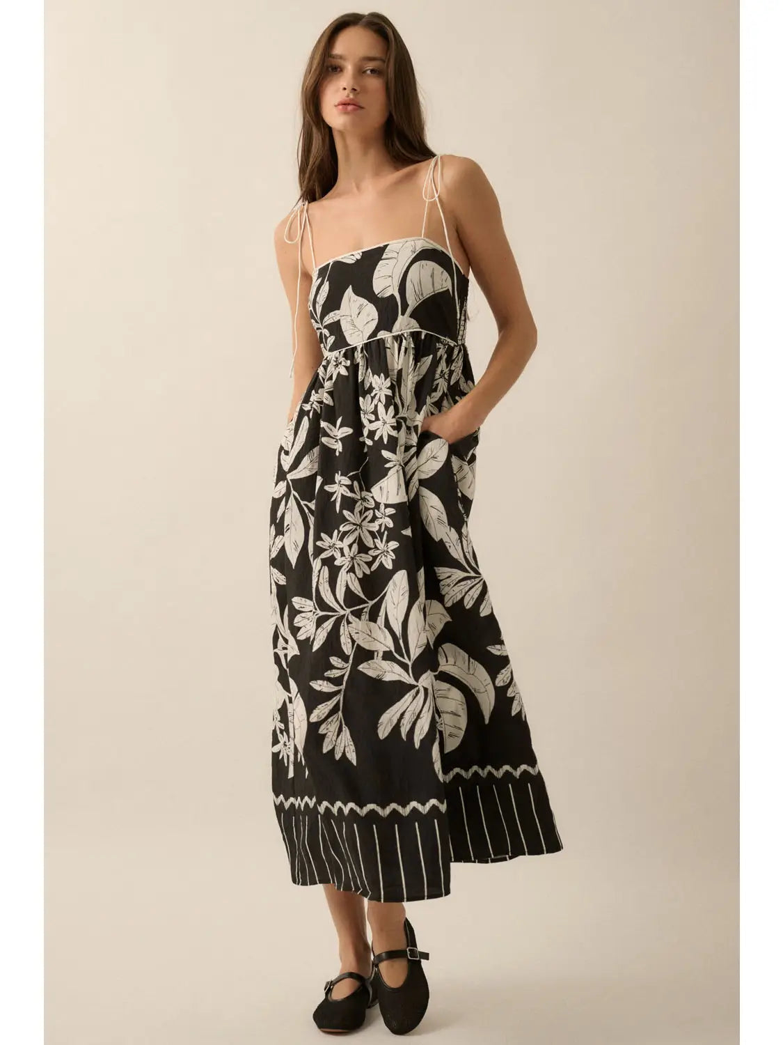 Black Tropical Maxi Dress showcasing pockets