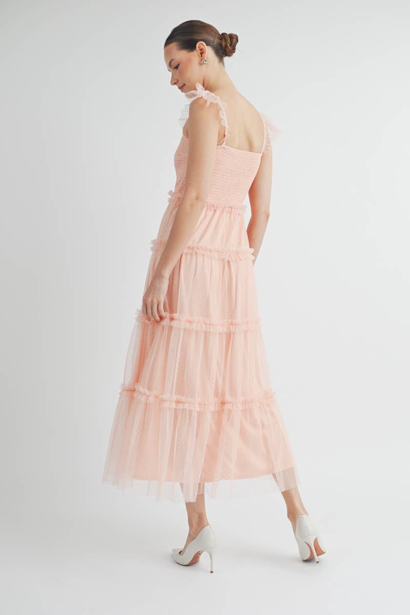 Full-length image of Clovette Midi Dress in blush pink highlighting romantic design