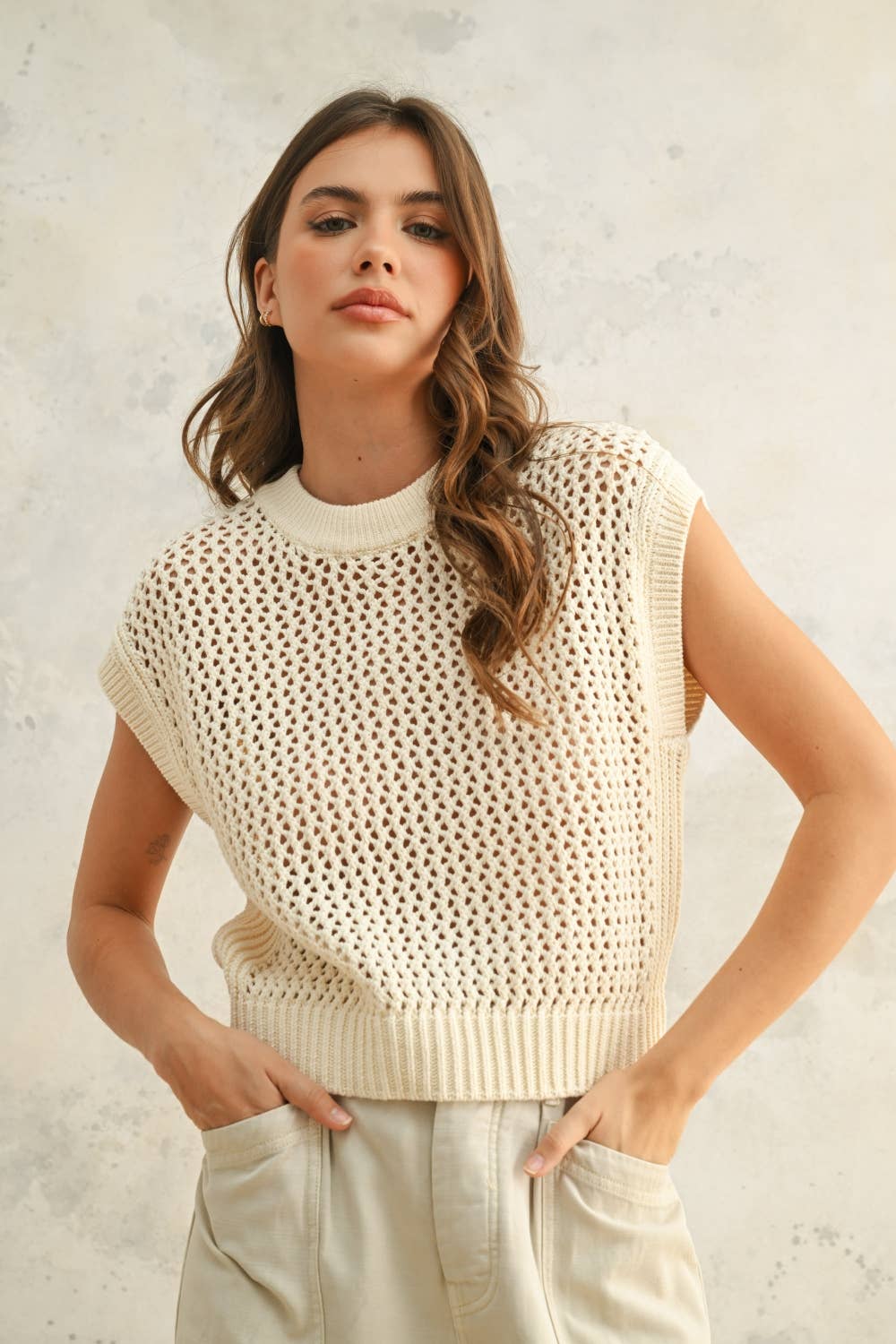 Cream Crochet Knitted Top featuring sleeveless style