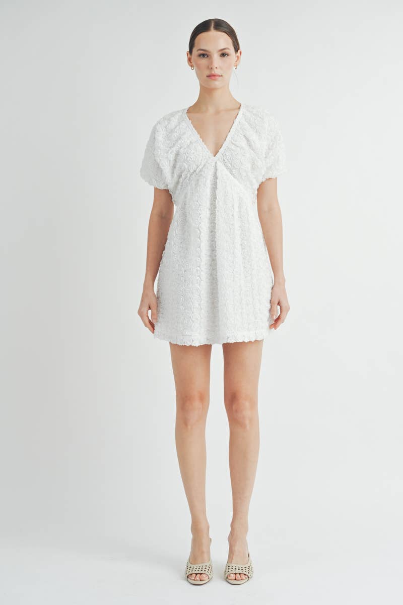 Floriane Mini Dress Front view of Floriane Mini Dress in white with 3D chiffon floral detailing and puff sleeves