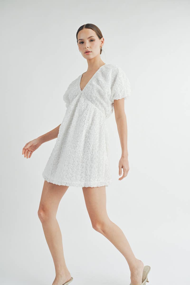 Side view of Floriane Mini Dress highlighting flattering V-neckline and flowy silhouette