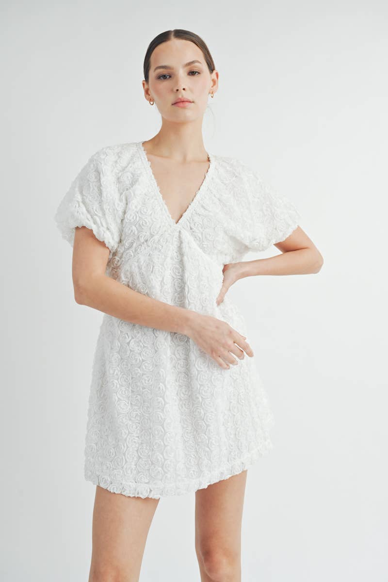 Full-length image of Floriane Mini Dress showing feminine mini length and romantic style