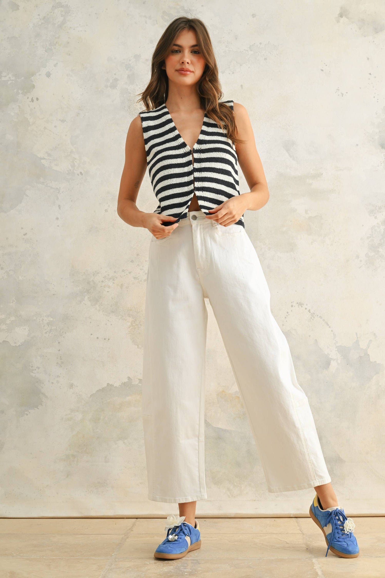 Front view of the relaxed ecru denim pants showing the clean, contemporary silhouette.