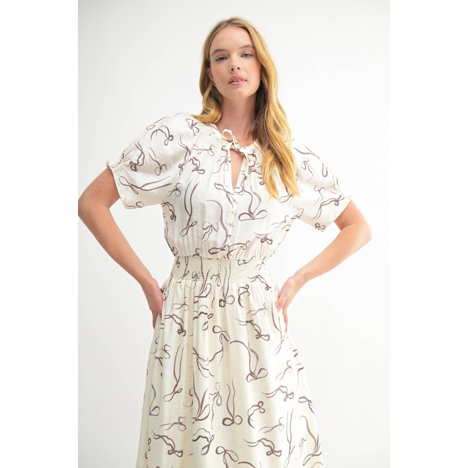 Ivory Bow Print Button Front Midi Dress featuring shirred waistline