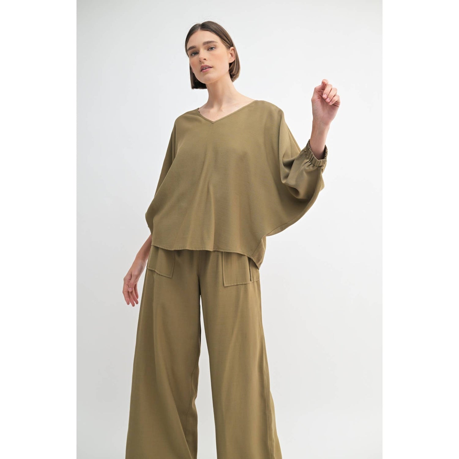 Olive Oversized Dolman V-Neck Top showcasing batwing sleeves
