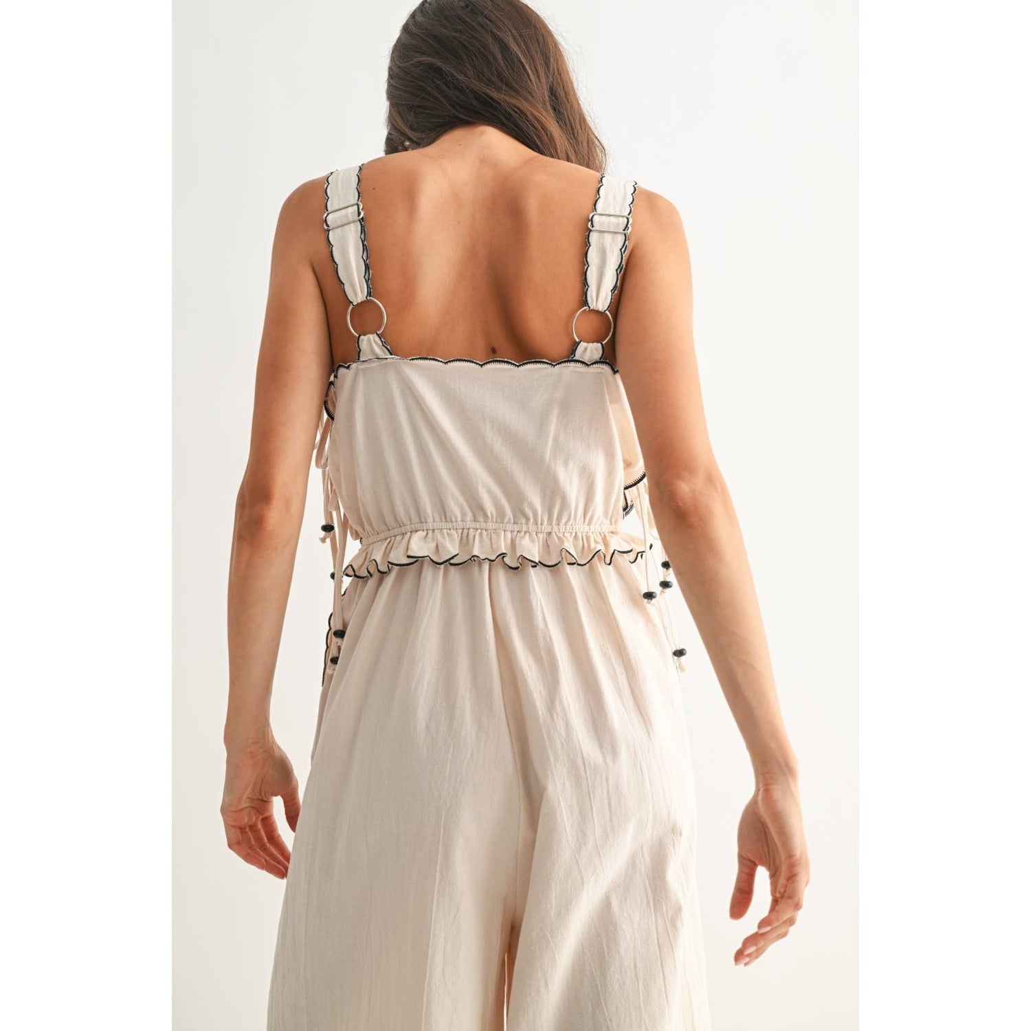 Sand Embroidered Jumpsuit with Unique Scalloped Edge close up of rear bodice
