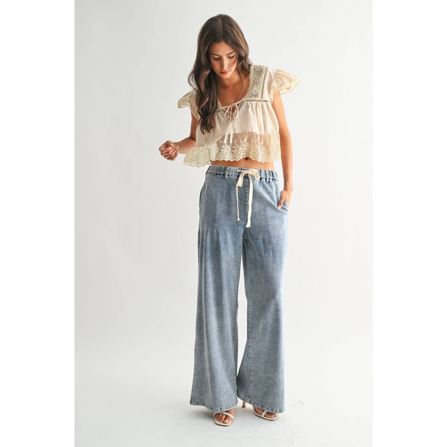 Sand Lace-Trimmed Blouse worn with denim