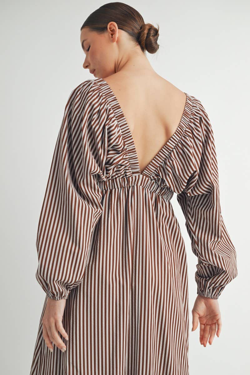 Side view of dress highlighting empire waistline and flattering silhouette