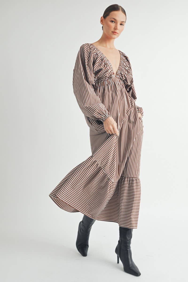 Detail shot of discreet side pocket on striped maxi dress