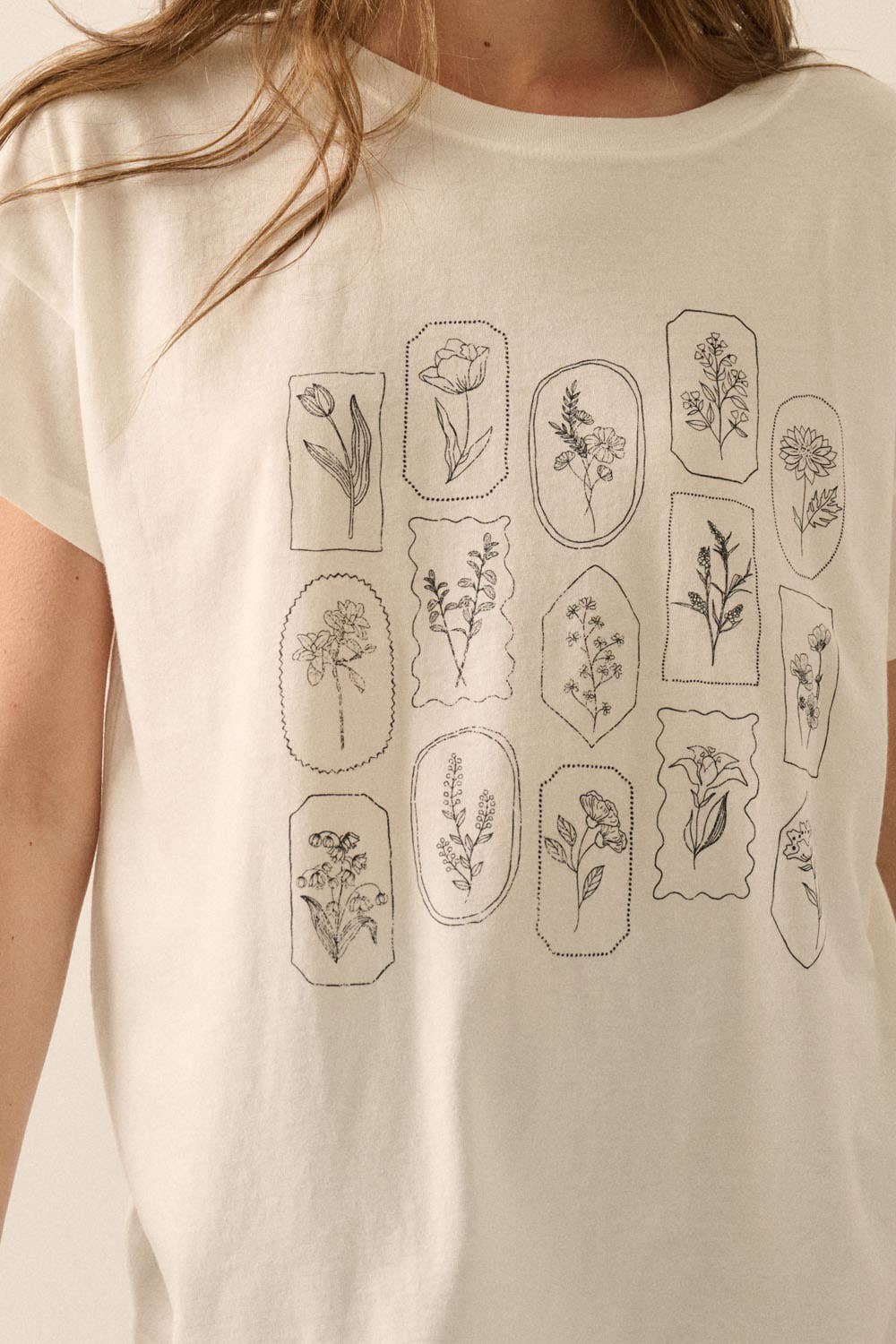 Very close-up detail of Amarae Graphic Tee showing floral print texture and beautifully lived-in fabric finish