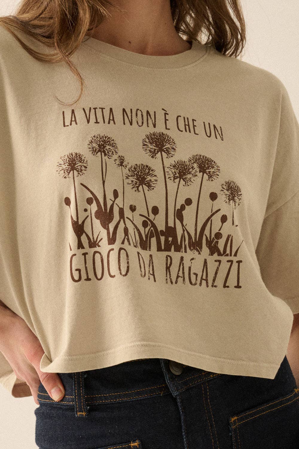 Very close-up front view of Lunetta Cropped Tee featuring Italian phrase “La Vita Non È Che Un Gioco Da Ragazzi” and soft worn-in finish